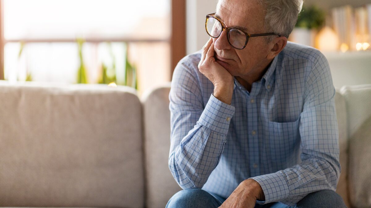 Man struggling with LGBTQ+ mental health challenges.