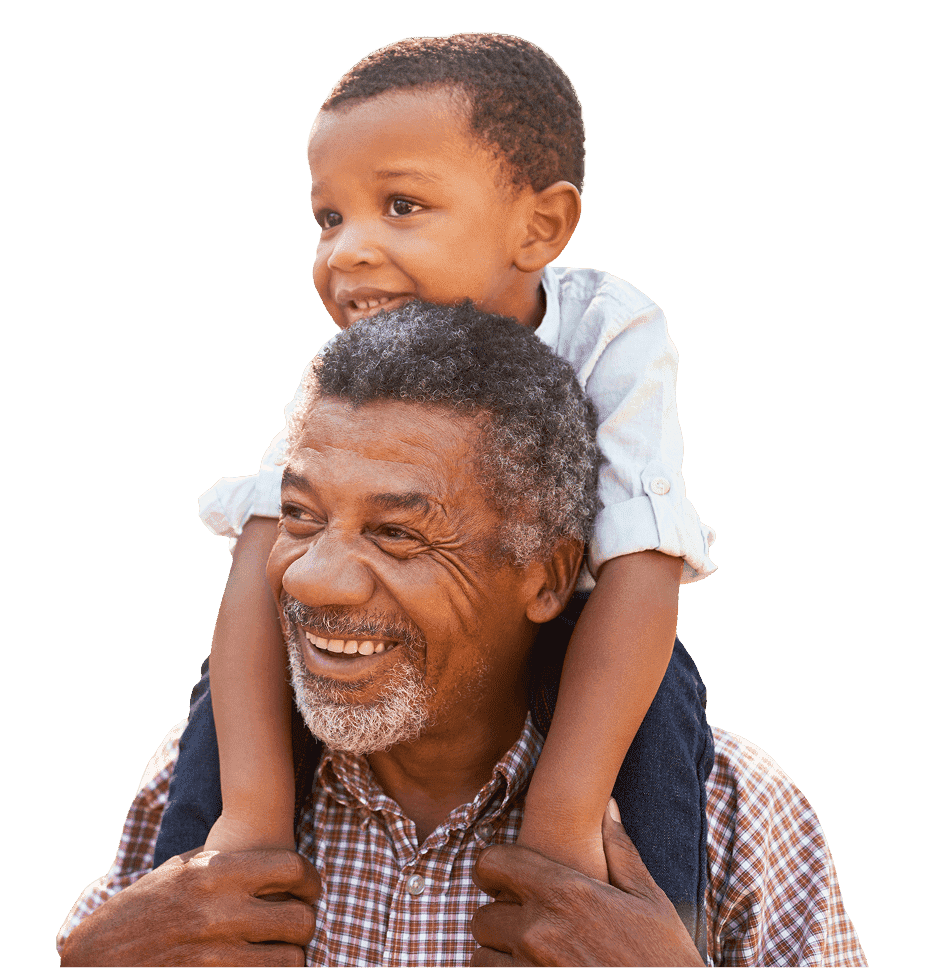 Smiling father giving his son a piggyback ride.