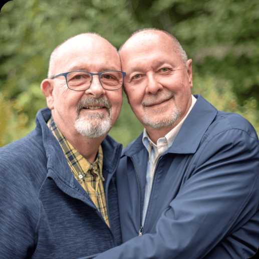 Two men hugging.