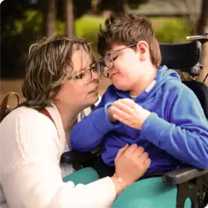 Mother caring for a son in a wheelchair.