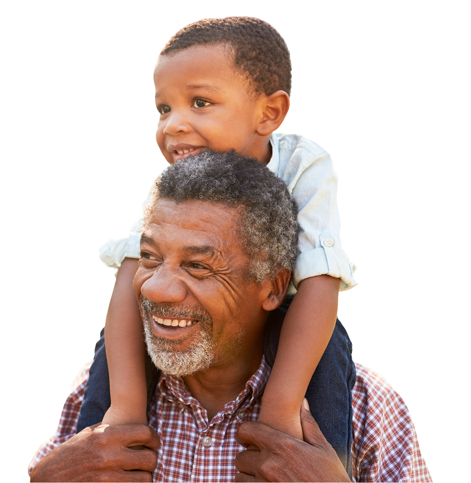 Smiling father giving his son a piggyback ride.